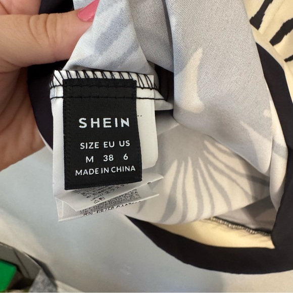 Women's Black and Cream Tropical Halter Mini Cutout Dress - Picture 7 of 8